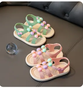 Pink and green girls summer sandals featuring colorful bow decorations and comfortable soft soles