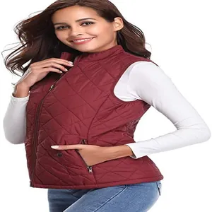 Detailed side view of women's burgundy quilted vest with zipper pockets and stand collar