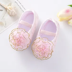 Soft sole pink baby princess shoes featuring decorative tulle flowers and elastic strap