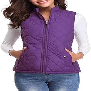 Detail view of purple women's quilted puffer vest with stand collar and zipper pockets