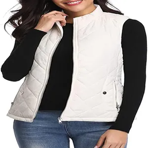 Detail view of women's white quilted puffer vest with stand collar and zipper pockets