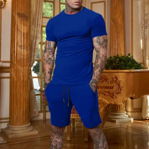 Royal blue short sleeve T-shirt and shorts athletic set on a male model in indoor setting