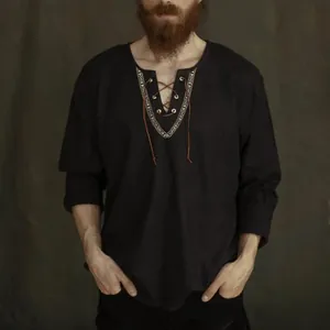 Close-up detail of a vintage medieval style cotton shirt featuring a unique lace-up neckline