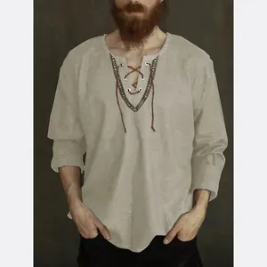 Close-up of men's casual V-neck linen shirt with embroidered drawstring neck detail