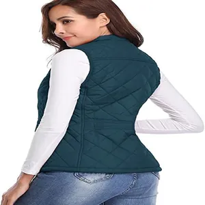Detailed back view of a women's quilted puffer vest with stand collar in dark teal