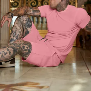 Detail view of pink men's summer sports set with short sleeve t-shirt and shorts