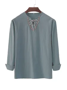 Men's teal cotton long-sleeve shirt with detailed lace-up neckline and ethnic trim