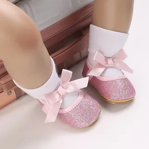 Adorable sparkly pink glitter baby princess shoes with satin bow detail for infant girls