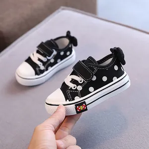 Toddler girls black polka dot canvas shoes with bow detail and soft sole walking sneakers
