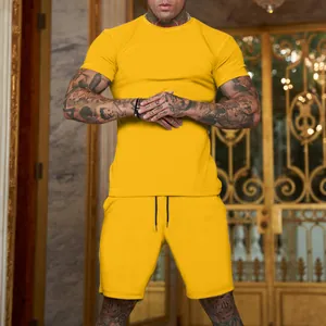 Men's summer sports set featuring a yellow T-shirt and shorts in a lifestyle setting