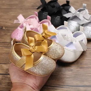 Baby girl princess shoes featuring glitter finish and large bow in various colors