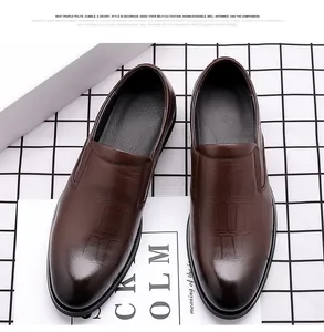 Top-down view of premium brown crocodile embossed leather slip-on dress shoes for men