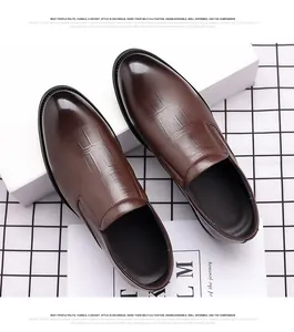 Detailed view of brown textured leather loafers with formal business design