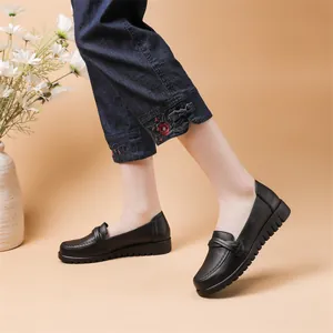 Elegant black cowhide women's slip-on loafers with soft round toe and non-slip sole