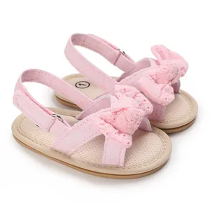 Detailed view of pink bow-knot baby girl sandals with breathable lace and soft soles