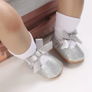 Detailed view of silver glitter baby girl princess shoes with soft rubber non-slip soles