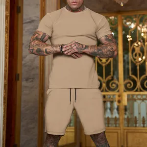 Detailed shot of a men's khaki solid color sports t-shirt and shorts outfit set