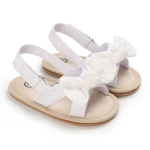 Breathable white lace baby girl sandals with decorative bow and flexible soft sole for toddlers