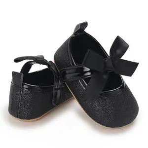 Detail view of black glitter baby girl princess shoes with soft anti-slip rubber sole