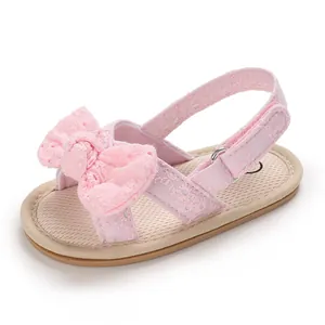 Detailed view of pink lace baby girl sandal with bow, breathable soft sole pre-walker