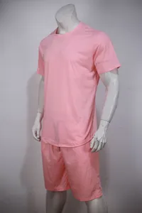 Pink short sleeve t-shirt and shorts sports set for men displayed on a mannequin