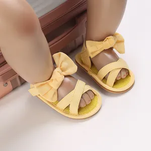 Yellow baby girl sandals with decorative bowknots and flexible soft rubber soles