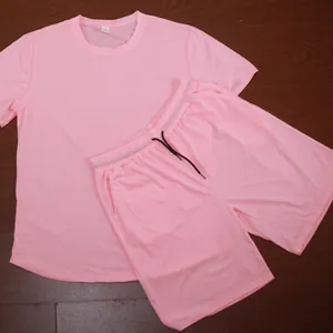 Close-up flat lay view of a pink men's short-sleeved T-shirt and matching shorts set