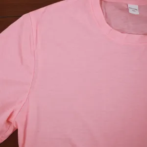 Detail of pink cotton T-shirt neckline showing fabric texture and 3XL size tag