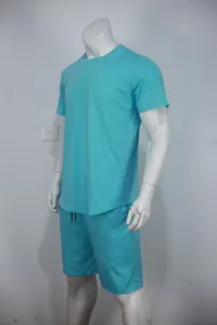 Detailed side view of the cyan men's sports set displayed on a full body mannequin