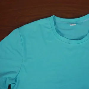 Close-up of men's turquoise sport t-shirt neckline showing premium stitching and fabric