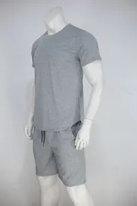 Detailed macro view of grey men's short-sleeved t-shirt and shorts set on mannequin