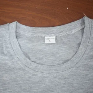Detail view of a grey t-shirt neckline showing a white size L tag and fabric stitching