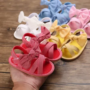 Detail view of colorful baby girl bow knot sandals with soft rubber soles