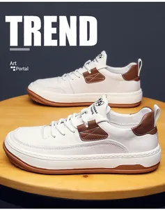 Détail rapproché de chaussures de skate en cuir blanc pour homme avec accents marron chic