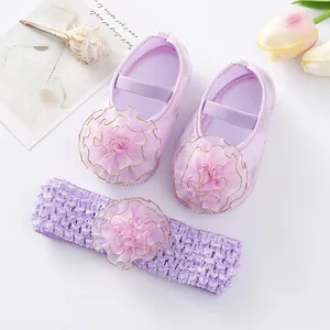 Close-up detail of purple baby princess shoes with matching crochet flower headband set