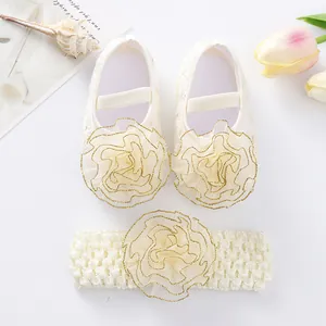 Detailed view of cream lace baby girl shoes and matching rose flower headband set