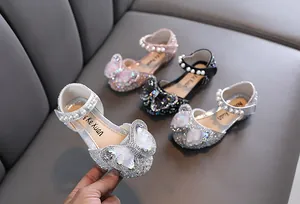 Sparkling princess dance shoes with crystal butterfly bow and pearl strap details.