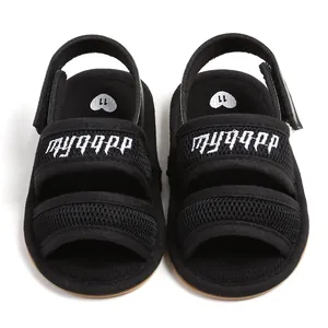 Close-up detail of breathable black mesh baby walking sandals with secure straps