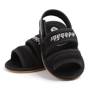 Detail of breathable black mesh baby sandals with stylish embroidered strap design