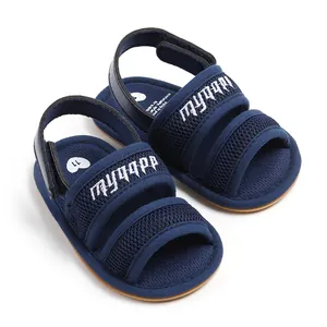 Close-up of navy blue mesh baby sandals featuring embroidered strap and soft walker sole