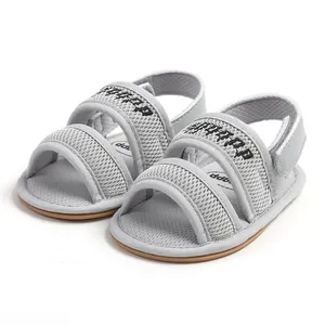 Close-up view of grey breathable mesh baby sandals with soft brown anti-slip sole.