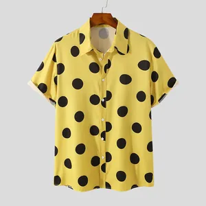Men's yellow short-sleeve shirt featuring a bold black polka dot print and lapel collar