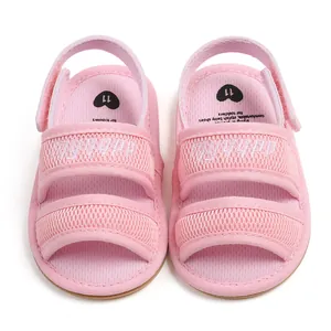 Close-up of pink breathable mesh baby sandals with soft soles and velcro straps