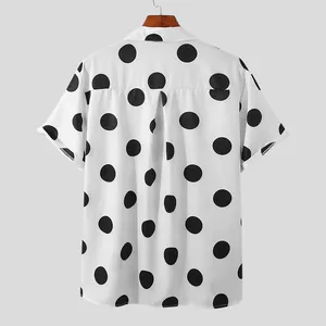 Back view detail of mens white short sleeve shirt featuring large black polka dot pattern
