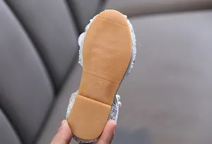 Detail of anti-slip rubber sole on girl's princess dance shoes with size 26 mark
