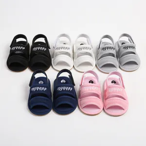 Multiple pairs of breathable baby mesh walking sandals in pink, navy, white, and grey