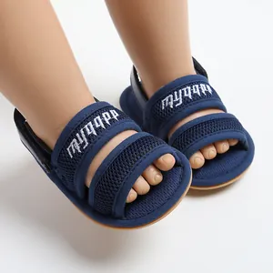 Close-up of navy blue breathable mesh baby sandals with white MYGGPP embroidery detail