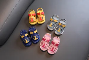 Four pairs of colorful anti-slip baby sandals in yellow, pink, blue, and grey