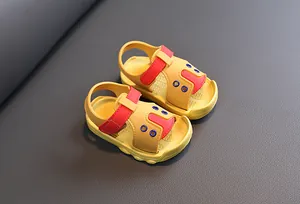 Detailed view of yellow and red baby summer sandals featuring non-slip soft soles for toddlers
