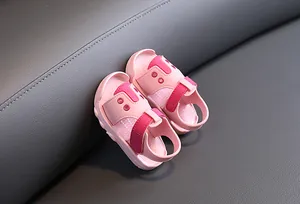 Close-up detail of breathable pink baby walking sandals with soft non-slip soles for toddlers